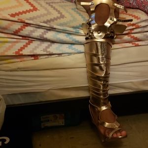 Knee high golden heels